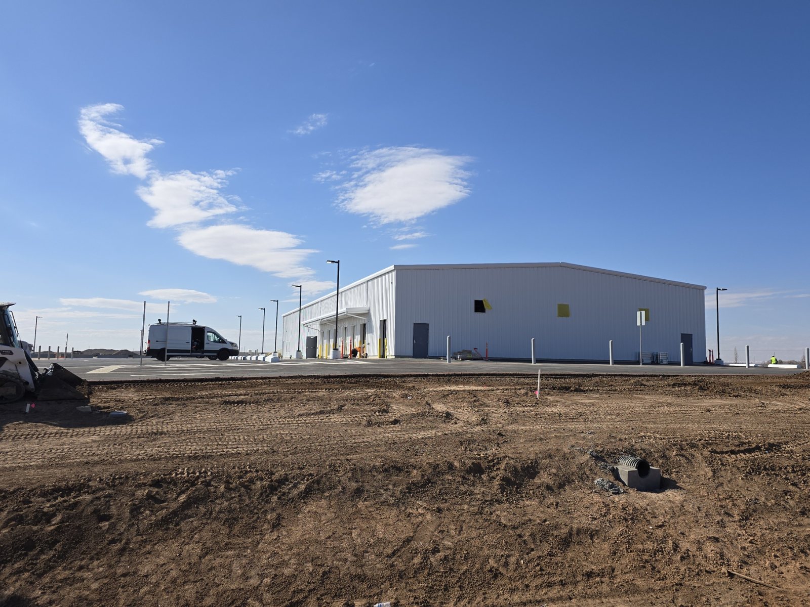 Commercial facility exterior during site survey and low-voltage infrastructure planning in West Texas