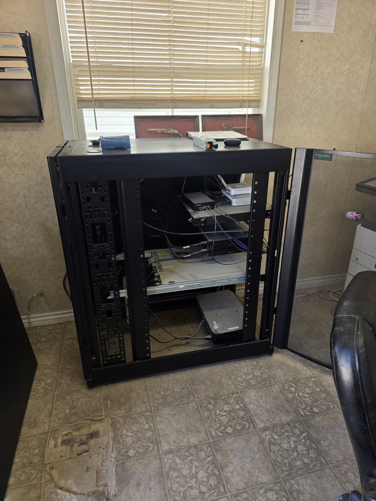 Network rack staged and ready for commercial equipment installation and rack-and-stack work