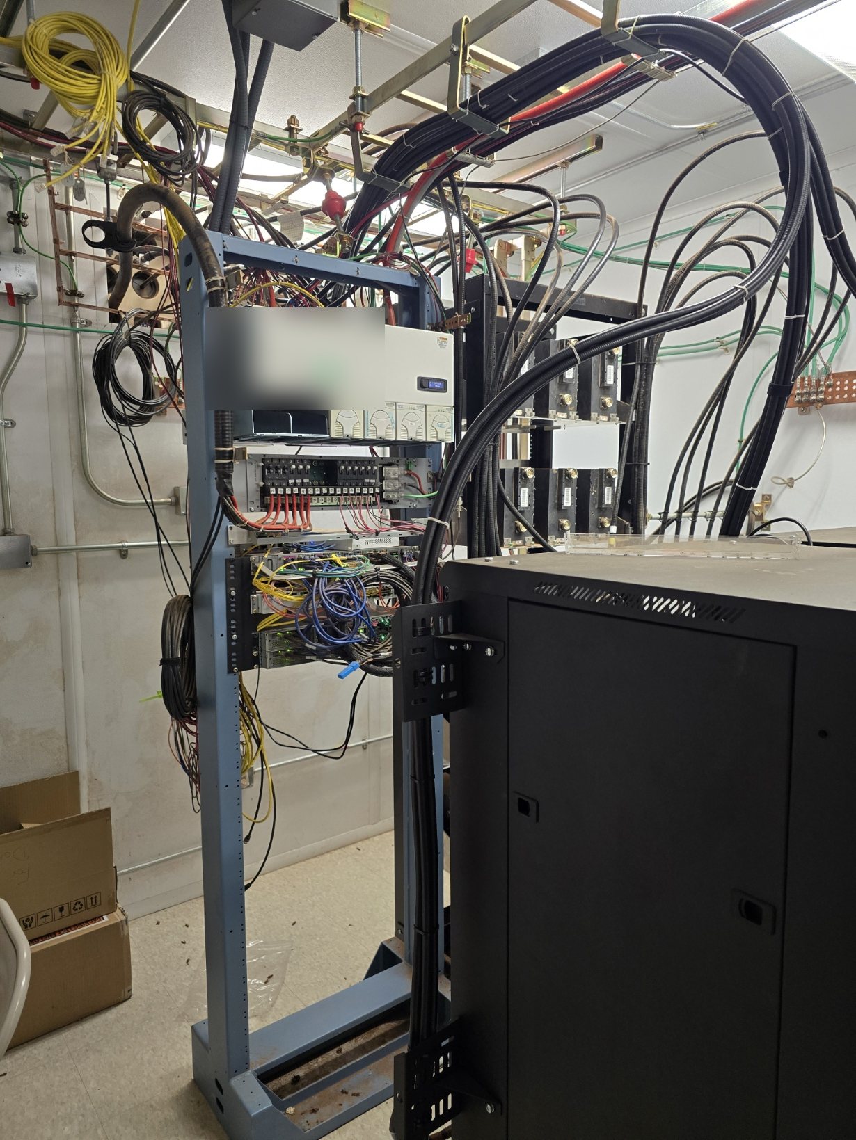 Complex MDF and building automation rack with conduit and cabling pathways in West Texas