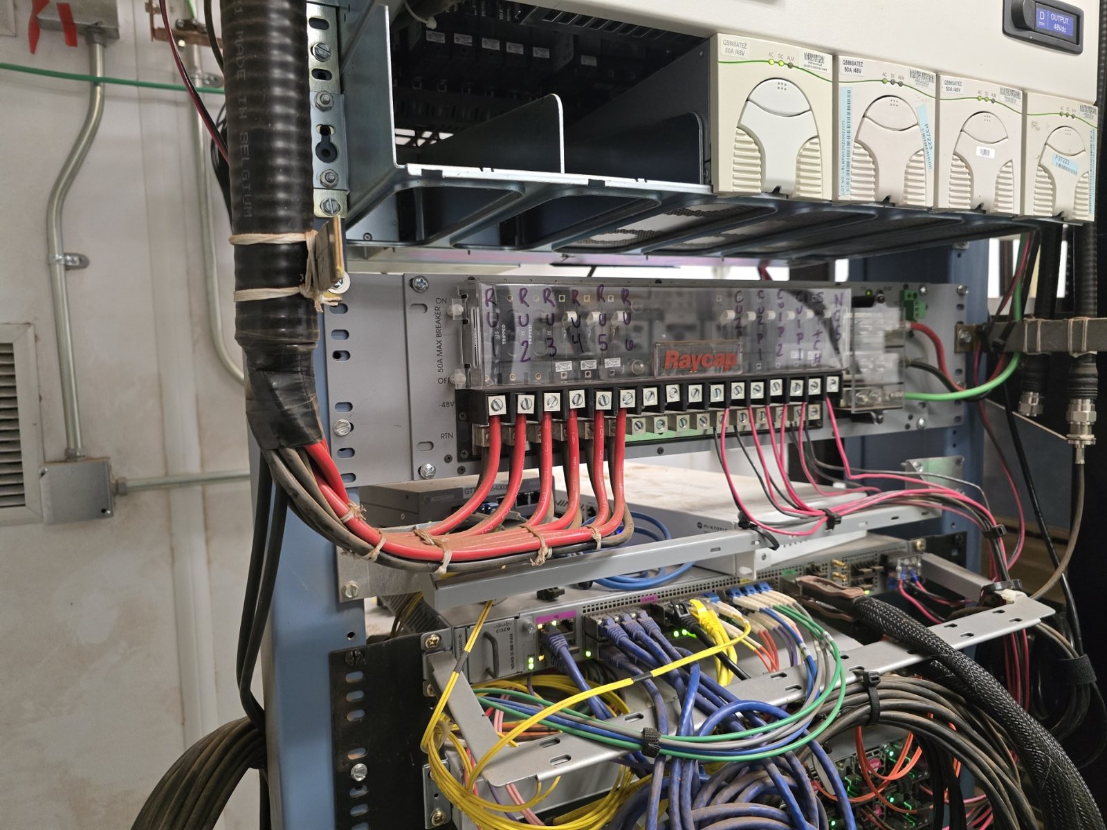 Power distribution and Cisco telecom rack with structured cabling and conduit support
