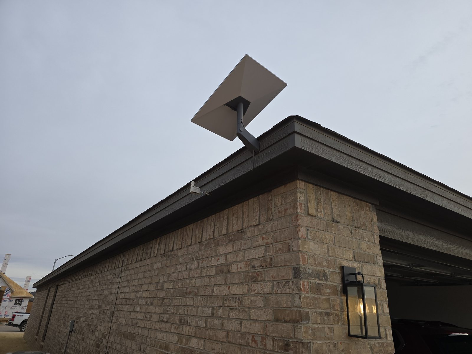 Rooftop wireless mount installation on a commercial brick building during field service